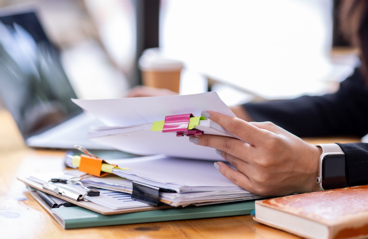 Compliance documents being filled out with IT partner